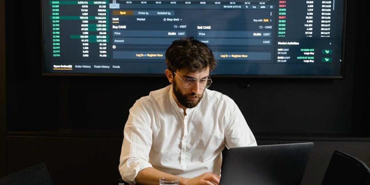 Focused Professional Man using Laptop 