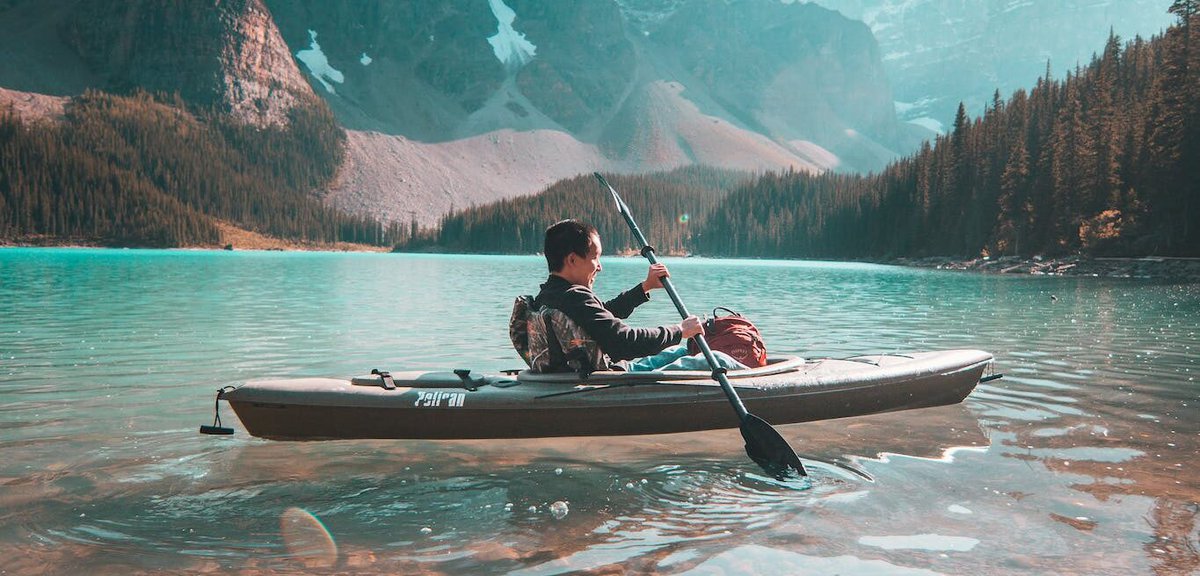 Person Riding on Gray Kayak